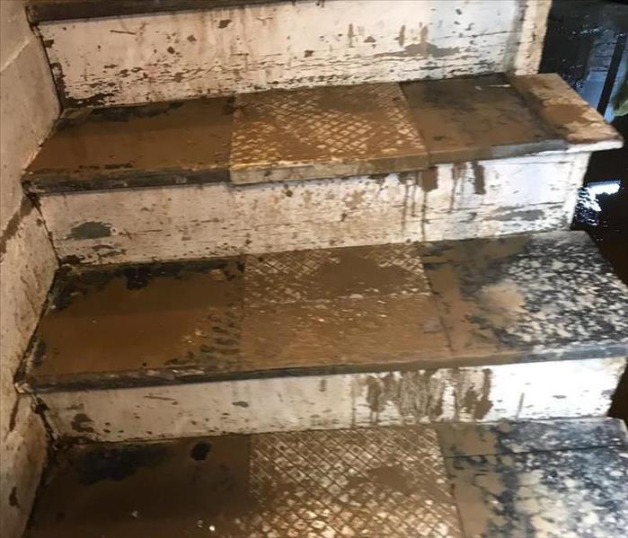 stairs to basements covered in sewage