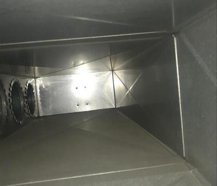 inside of a metal duct with clean walls and floor