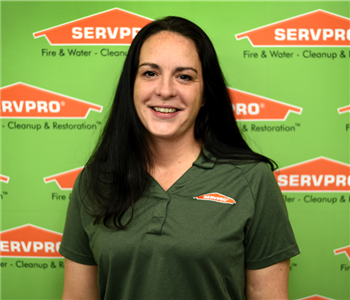 image of female sitting in front of SERVPRO® backdrop