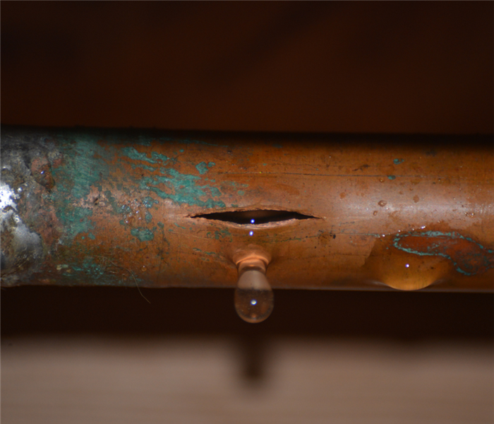 burst copper pipe with crack in it