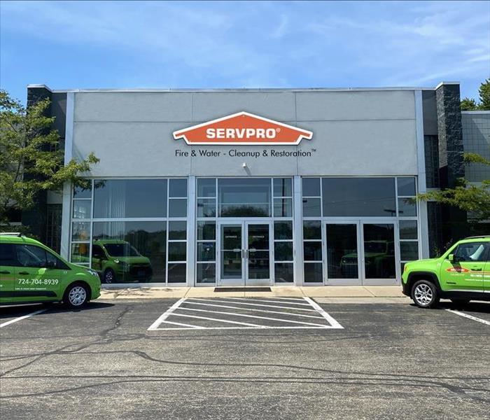 image of new servpro warehouse with two vehicles parked on each side